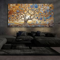 a living room with a large painting on the wall and couches in front of it