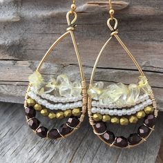 These fun earrings are made with a gold plated drop frame, tarnish-resistant gold plated copper wire, eggplant and gold faceted Czech glass beads, white Japanese seed beads, and citrine chip beads. The ear hooks are 14k gold-plated. These earrings measure 24x47mm and are lightweight. Colors do vary on different monitors; please keep this in mind. ~Care instructions: Not waterproof- do not wear while showering, swimming, etc. As with all jewelry, keep away from children and pets, and store in a d 14k Gold-filled Beaded Drop Earrings, Dangle Beaded Earrings With 14k Gold Filled, Beaded 14k Gold Filled Dangle Earrings, Bohemian Beaded 14k Gold Filled Earrings, 14k Gold Filled Dangle Beaded Earrings With Gold Beads, 14k Gold-filled Dangle Beaded Earrings With Gold Beads, Bohemian 14k Gold Filled Beaded Dangle Earrings, Bohemian 14k Gold-filled Beaded Dangle Earrings, Bohemian 14k Gold Filled Beaded Earrings