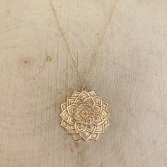 "A gorgeous 14kt gold filled carved flower pendant hangs from a delicate 14kt gold filled chain. Necklace is adjustable 16\"-17\". Flower pendant is appropriately 1 1/4\" wide." Gem Necklaces, Mandala Jewelry, Mandala Necklace, Gold Jewellry, Gem Necklace, Shiny Things, Girly Jewelry, Jewellery Designs, Gold Filled Chain