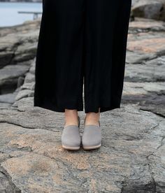 The Brett clog is a stylish and comfortable addition to your shoe collection! With its closed-back design and open-side detail, this timeless piece is sure to turn heads. Made for those who crave unique quality fashion. Clog measurements:Heel height: 2 5/8” (6.5 cm)Toe height:1 1/2″ (3.8 cm) Fit:NarrowLeather:Nubuck leatherClogs consist of:Base: European Lime Wood Sole: Rubber sole Fastening: Staples Workwear Slip-on Clogs With Rubber Sole, Everyday Spring Clogs With Round Toe, Everyday Round Toe Clogs For Spring, Everyday Flat Heel Clogs With Rubber Sole, Everyday Flat Heel Clogs With Removable Insole, Modern Slip-on Closed Toe Clogs, Flat Heel Clogs With Rubber Sole For Workwear, Casual Almond Toe Clogs For Work, Casual Almond Toe Clogs For Workwear