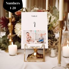 a table with candles, flowers and a sign that says numbers 1 - 20 on it