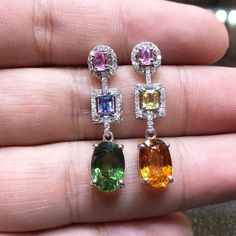 Wow! Gorgeous Natural Sapphires Earrings! FOR VIDEO: http://www.youtube.com/watch?v=k3Pin5-Lhp8 With 3.86 carats Gentle Heated Green Sapphire and 3.40 carats Heated Yellow sapphire. Accentuating the mains stones are the 2 unheated pastel pink sapphires, 1 unheated pastel yellow sapphire, and 1 unheated pastel blue sapphire, all from Ceylon. 0.60 carat of NATURAL E/VVS diamonds. Set in 6 grams of 18K solid gold, handmade earrings. HANDMADE BY PROFESSIONAL GOLDSMITH! Ship from Utah. In case of ret Crystal Dangle Earrings, Modern Gift, White Gold Earrings, Beaded Dangle Earrings, Crystal Drop, Diamond Crystal, Chandelier Earrings, Silver Earrings Studs, Earings Piercings