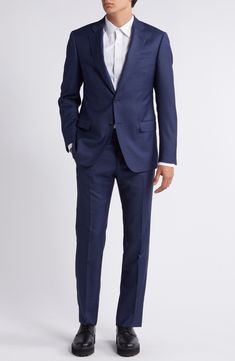 Classic and smart, this wool suit styled in a dark-blue mélange features traditional detailing that makes it a versatile addition to any formal wardrobe. Jacket has notched lapels; chest welt pocket; flap pockets; side vents Trousers have zip fly; slant pockets; back button-welt pockets Jacket is lined; trousers are lined to the knee 100% virgin wool Dry clean Imported Church Outfit Men, Indigo Blue Suit, Bride Pants, Blue Linen Suit, Armani Suit, Blue Suit Jacket, Armani Suits, Formal Coat, Blue Suit Men