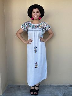 "Elegant dress and colourful hand-embroidery. Perfect for mexican weddings, mexican parties, etc. Made in the 80's Loose fit Fits size Small-Medium Measurements taken flat: Armpit to armpit 22\" Bottom hem width 26\" Shoulder to bottom hem 51 1/2\" Note: In the last pic shows a flaw the dress has, price has been reduced" Bohemian Peasant Dress With Short Sleeves, Casual Short Sleeve Peasant Dress For Summer, Short Sleeve Dress With Multicolor Embroidery For Summer, Multicolor Embroidery Short Sleeve Summer Dress, Floral Print Peasant Dress For Vacation, Peasant Style Floral Print Dress For Vacation, Summer Festival Peasant Dress, Peasant Style Summer Festival Dress, Bohemian Embroidered Peasant Dress For Summer