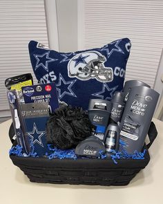 the gift basket is filled with personal care products and toiletries, along with a football pillow