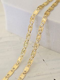 Beautiful solid 14k yellow gold Valentino Star Diamond Cut chain. Perfect for everyday and every occasion. Elegant, unique and everlasting. This Chain will make the Perfect gift. 14k gold will not tarnish or rust. Unisex.  Materials: 14k solid yellow gold. Length: Available in 16 to 24 Inches. Thickness: 2.1mm. Weight: 16''= 2 grams - 18''= 2.2 grams - 20''= 2.3 grams - 22''=2.6 grams - 24''= 2.8 grams. (May vary)  Brand New. 14k gold stamped. The chains in the video are 16", 18," and 20" Inches :) Briza Collections is a small family owned business that works hard on providing the best selection of Fine Solid Gold Jewelry for the best prices.  Our Goal is to bring you happiness and satisfaction, for this reason if you are not satisfied with your purchase we will accept Refunds and exchange 14k Gold Link Chain Necklace, 14k Stamped Yellow Gold Chain Necklace As Gift, 14k Gold Hallmarked Link Chain Necklace, 14k Yellow Gold Chain Necklace As A Gift, Tarnish Resistant 14k Gold Chain Necklace For Anniversary, Gift 14k Stamped Yellow Gold Chain Necklace, Diamond Cut Link Chain Necklace As Gift, Diamond Cut Link Jewelry For Gifts, Tarnish-resistant Oval Link Chain Necklace For Anniversary