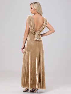 the back of a woman wearing a gold velvet dress