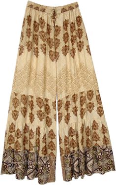 Brown flora print on wide-leg pants, which are soft and flowy, wide legs with a flair of a complementary graphic print.  The loose-fit wide-leg printed mix palazzo pants have a comfortable waist that will fit a small to a large. #tlb #SplitSkirtsPants #Printed #bohemianfashion #festivalpants Printed Wide Leg Pants For Vacation, Vacation Floral Print Wide Leg Pants, Bohemian Wide-leg Floral Print Bottoms, Summer Floral Print Wide-leg Harem Pants, Patterned Bottoms With Boho Print For Spring, Bohemian Summer Pants With Printed Motifs, Bohemian Wide-leg Pants With Floral Print, Summer Bohemian Pants With Printed Motifs, Floral Print Wide Leg Harem Pants For Vacation