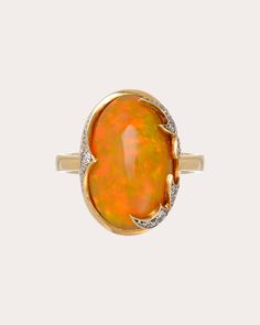 Set atop an 18-karat gold band, the Flare ring is centered around an oval-cut Ethiopian opal. The face's abstract flame motifs are decorated with pavé-set diamond embellishments to create ambient shimmer. From Roberta do Rio's Fire Spell Collection. 18k yellow gold, Ethiopian opal and diamond Carat: 0.0006 ctw diamond, 8.9 ctw opal Polish with soft cloth Made in Brazil Measurements Size 7 inner diameter: 17.3mm (0.68in) Opal Rings With Polished Finish For Formal Occasions, Modern Oval Opal Ring For Formal Occasions, Formal Opal Rings With Polished Finish, Luxury Rings With Oval Cabochon Gemstone Accents, Luxury Rings With Gemstone Accents In Oval Cabochon, Heirloom Oval Opal Ring For Formal Occasions, Oval Cabochon Opal Ring Fine Jewelry, Oval Cabochon Opal Ring In Fine Jewelry, Fine Jewelry Oval Cabochon Opal Ring