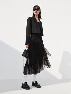 MO&Co. Women's Elasticated Ruffle Laced Skirt Features : - Midi length with a flowy fit- Elasticated waist- Asymmetrical, tulle ruffle layers design Code: MBC1SKTT11The back length of size S is 82cmMATERIALS & CARE Material: 100% PolyesterGentle machine wash below 30°CDo not bleach, hang to dry in the shadeDo not tumble dry, do not ironDo not dry clean, do not soakDo not rub, wash separately in mesh bagWash with neutral detergentPlease select your own size in the size chart according to your fig Black Skirt Wedding Outfit Guest, Black Ruffled Skirt Outfit, Ruffled Skirt Outfit, Tulle Skirt Fashion, Ruffle Skirt Outfit, Tulle Layered Skirt, Black Ruffled Skirt, Short Tulle Skirt, Layers Outfit