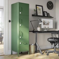 a green filing cabinet sitting next to a desk