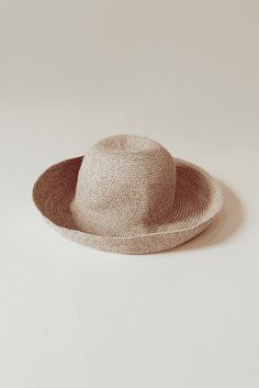 Whether you're attending rowing regattas, enjoying summer picnics, or leisurely drifting down the river, our woven raffia straw hat is the perfect companion. Featuring a timeless dome boater style with a charming flipped edge, it effortlessly combines elegance with a laid-back vibe. This is the epitome of the relaxed yet refined look we're all embracing this year. COUTONIC VINTAGE COLLECTION The COUTONIC Vintage Collection is not just a fashion collection; it's a sustainability-conscious homage Spring Coastal Boater Hat Made Of Toquilla Straw, Curved Brim Sun Hat With Upf 50+ For Picnic, Lightweight Flat Brim Crochet Hat For Spring, Curved Brim Crochet Hat For Warm Weather, Upf 50+ Curved Brim Hat For Picnic, Beige Woven Boater Hat With Flat Brim, Vacation Straw Hat With Woven Details, Beige Woven Straw Hat With Curved Brim, Brimmed Crochet Hat For Spring Warm Weather