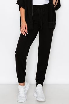 Made for active or relaxed days, these high rise relaxed joggers are the newest style added to our loungewear collection. Featuring a high-rise elasticized waistband with a drawstring detail, two pockets on each hip and cuffed hems, you’re going to love these full length loungewear joggers . High rise elasticized waistband Drawstring feature Two pockets on each hip Ultra-soft knit fabric with stretch 62% Polyester, 33% Rayon, 5% Spandex Imported Model StatsHEIGHT: 5'5" BUST: 32WAIST: 25.5HIPS: 3 Solid Color Drawstring Jogging Pants, Solid Color Drawstring Sweatpants For Loungewear, Drawstring Long Jogging Pants, Solid Color Sportswear Bottoms With Drawstring, Solid Sportswear Bottoms With Drawstring, Sportswear Joggers With Drawstring, Sportswear Bottoms With Drawstring For Leisure, Trendy Sweatpants For Lounging, Relaxed Fit Drawstring Sweatpants For Lounging