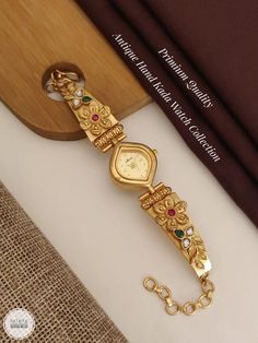 Description :- Womens Watch, Gold Personalized Watch, Engraved Watch, Gift for Her, Womens Gift, Gift for Wife, Bridesmaid Watch, Watches for Women Gift yourself a royal look with this perfectly crafted kundan necklace set from Manalisstudio. Crafted with high quality, it is impressive in design. The green enamel artwork adds perfect texture to the design. Perfect for weddings and festivities, this antique necklace set should be put on with your favorite sari or lehenga. 100% Satisfaction. Long Yellow Gold Watch With Rectangular Dial For Gift, Yellow Gold Watch With Rectangular Dial As Gift, Luxury Jewelry And Watches With Round Dial For Wedding, Luxury Wedding Jewelry And Watches With Round Dial, Elegant Analog Watches For Wedding, Engraved Watches With Rectangular Dial For Anniversary, Engraved Watch With Rectangular Dial For Anniversary, Gift Watch With Bracelet Strap And Rectangular Dial, Gift Jewelry With Diamond Hour Markers And Round Dial