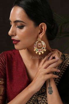 The Gold-plated navrattan chandbali is an ode to the colorful land of India with its joyful hues of red, green, blue, yellow, and white. The navrattan earrings are carefully handcrafted by the artisans to make your look stand out. This Indian navrattan jewelry piece is an elegant replica of Sabyasachi jewelry that you can pair with any ethnic or contemporary ensembles. Closure - Push Back. Style Tip - Since they look very subtle you can mix and match them with any western or traditional wear to Sabyasachi Jewelry, Sabyasachi Jewellery, Chandbali Earrings, Multicolor Earrings, Earrings Indian, Stone Choker, Kundan Necklaces, Traditional Wear, Victorian Jewelry