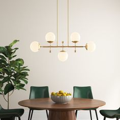 a dining room table with green chairs and a bowl of fruit on it