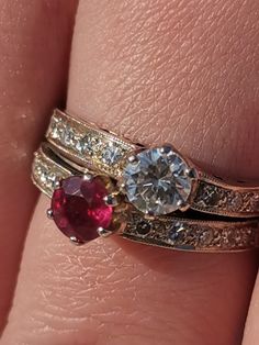 RING SIZE: 7.5 US, 55 EU 14K GOLD. WEIGHT: 4.67 grams STONES: ruby, diamonds RUBY: authentic, 0.45 ct. TOTAL DIAMOND WEIGHT: 0.95 ct. COLOUR: H CLARITY: Vsi CONDITION: EXCELLENT Elegant Art Deco ruby and diamond ring in 14K gold. Contains 0.95 carat diamonds with Vsi clarity and H color. The largest diamond is 0.45 carat and the genuine, vibrant red ruby is also 0.45 carat. The ring weighs 4.67 grams and is US size 7.5 and EU size 55, but we offer resizing for free! This classic art deco style r Princess Cut Ruby Ring With Brilliant Diamond, Diamond White Ruby Ring For Anniversary, Wedding Ruby Ring With Vvs Clarity Marquise Cut, Anniversary Diamond White Ruby Ring, Classic Emerald Cut Ruby Ring With Diamonds, Round Ruby Ring In Platinum For Wedding, Timeless Ruby Ring With Vvs Clarity For Wedding, Anniversary Ruby Ring In Diamond White, Heirloom Ruby Ring With Brilliant Cut