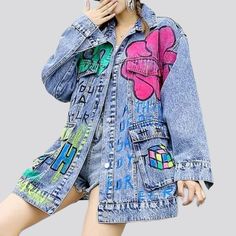 Make a bold statement with our Painted Graffiti Print Denim Jacket from the 2023 Autumn-Winter Collection! This Y2K-inspired piece is designed to be lengthy and oversized. with a unique graffiti print and buttoned closure. making it the perfect addition to any wardrobe.Distinctive Features: Y2K Style: This jacket is designed with a Y2K-inspired style. featuring an oversized fit and a unique graffiti print. Painted Graffiti Print: The jacket features a one-of-a-kind painted graffiti print. a mode Denim Blue Denim Jacket With Graphic Print, Relaxed Fit, Denim Blue Jacket With Graphic Print And Relaxed Fit, Relaxed Fit Denim Blue Denim Jacket With Graphic Print, Relaxed Fit Denim Jacket With Graphic Print, Spring Grunge Relaxed Fit Outerwear, Spring Denim Blue Outerwear With Graphic Print, Spring Denim Outerwear With Graphic Print, Grunge Denim Jacket For Spring Streetwear, Oversized Printed Spring Outerwear