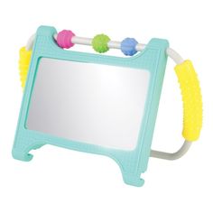 a mirror that is shaped like a frame with different colored objects on top of it