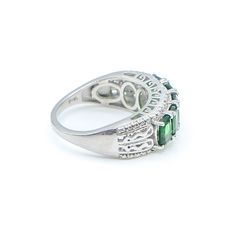 Sterling Silver Chrome Diopside Half Eternity Band Ring Size 8 With Diamonds. This Platinum Plated Sterling Silver Half Eternity Band has all the details you can ask for. Five gorgeous oval cut Green Chrome Diopside gemstones accented by four small round cut White Diamonds for extra sparkle. The ring features beautiful scrollwork detailing along the band as well as on the designer side panel. Complete with a comfort fit design, which allows the ring to slide on smoothly and it is more comfortabl Classic Green Emerald Ring With Gemstone Accents, Classic Oval Green Sapphire Ring, Classic Green Sapphire Oval Ring, Classic Green Oval Sapphire Ring, Classic Green Multi-stone Sapphire Ring, Classic Green Multi-stone Emerald Ring, Classic Emerald Ring With Gemstone Accents For May Birthstone, Oval Multi-stone Tsavorite Rings, Tsavorite Rings With Gemstone Accents For Anniversary