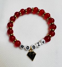 Woozy's Red Ruby themed bracelet Personalized Red Charm Bracelet As Gift, Adjustable Red Round Charm Bracelet, Adjustable Red Charm Bracelet, Adjustable Round Red Charm Bracelet, Personalized Red Name Bracelet With Round Beads, Adjustable Personalized Red Wristband, Personalized Red Stretch Bracelet, Casual Style, Customized Red Beaded Bracelets With Round Beads, Customized Red Beaded Bracelets As Gift