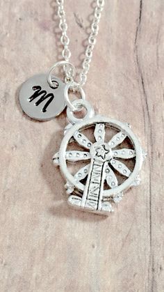 "This listing is for a hand-stamped initial necklace featuring a 3/5\" x 1/2\" silver plated pewter Ferris wheel charm & 3/10\" stainless steel initial pendant. The silver plated chain is 18\" long, but can be made to your desired length- see last photo in listing. Please indicate the chain length you would like in the 'notes to seller' section at checkout. All items are lead & nickel free. Message me with any questions, thank you! Add an initial to any necklace https://www.etsy.com/list Themed Personalized Charm Necklaces, Adjustable Themed Silver Charm Necklaces, Themed Adjustable Silver Charm Necklaces, Adjustable Silver Themed Charm Necklaces, Personalized Silver Charm Necklace, Personalized Themed Sterling Silver Jewelry, Silver Vintage Charm Initial Pendant Jewelry, Silver Vintage Charm Jewelry With Initial Pendant, Silver Jewelry With Vintage Charm Initial Pendant