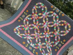 a quilted table topper with an intricate design on it