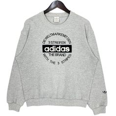 Adidas Trefoil Embroidery Spell Out Logo Crewneck Sweatshirt Sportswear Grey Size Medium  * Size on Tag : M * Manual Measurement (inch) : Chest 22.5, Length 25, Shoulder 22, Sleeve 22.5, Hem 17. * Recommended for Size : Medium (M) * Color : Grey * Condition : Used Condition. * See photos for details. * Free Defect : No Stain, No Holes, No Tears, No Faded. 106 Basic Winter Tops With Logo Print, Sporty Embroidered Logo Sweater For Fall, Fall Sportswear Sweater With Letter Print, Basic Tops With Embroidered Logo For Streetwear, Sporty College Sweater With Logo Print, Basic Sports Sweats With Crew Neck, Sporty Fall Sweater With Embroidered Logo, Basic Crew Neck Sweats For Sports, Fall Letter Print Sportswear Sweater