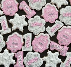 pink and white decorated cookies with snowflakes