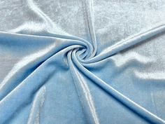 a close up shot of a light blue fabric