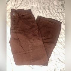 Dark Brown Comfortable Cargo Pants Jean Material. Warm With Lots Of Working Pockets, Zipper, Button, Belt Loops And A Durable But Soft Material. Straight Leg Fit Size Small Or 4. Bought For $55 Never Worn. Brown Straight Leg Pants With Button Closure, Trendy Cotton Cargo Jeans With Button Closure, Casual Brown Wide Leg Cargo Jeans, Brown Wide Leg Bottoms With Buttons, High Waist Brown Cotton Cargo Pants, High Waist Brown Cotton Cargo Jeans, High Waist Brown Cargo Jeans, Brown High Waist Pants With Buttons, Trendy Brown Wide Leg Pants With Pockets