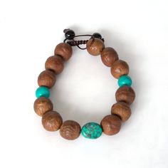 Gift a symbol of deep spiritual connection this Valentine's Day with our handmade Nepali Bodhi beads bracelet. Each bead, introduced and blessed by His Holiness the Dalai Lama, encapsulates the essence of love and mindfulness to help you feel peaceful and connect with your inner self. Our adjustable bracelet, crafted in the heart of the Himalayas, features authentic grey Bodhi beads from Nepal. Revered in Hinduism and Buddhism for their spiritual significance, these beads have been introduced to Spiritual Turquoise Beaded Bracelet With Wooden Beads, Spiritual Turquoise Beaded Bracelets With Wooden Beads, Spiritual Wooden Beads Stretch Bracelet For Healing, Artisan Handmade Bracelets For Meditation, Holistic Wooden Beads Bracelets For Meditation, Turquoise Beaded Bracelets With Wooden Beads For Healing, Holistic Wooden Beaded Bracelets For Meditation, Adjustable Bracelets For Meditation And Festivals, Adjustable Beaded Bracelets For Rituals