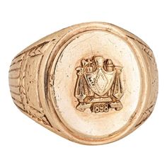 Finely detailed antique Victorian family crest signet ring (circa 1898), crafted in 10 karat yellow gold.   The oval signet mount features a family crest with the year '1898' to the base. The side shoulders feature a pretty etched foliate design. The low rise ring (3.5mm - 0.13 inches) sits comfortably on the finger.    The ring is in good condition with some wear evident. We have not cleaned it in order to preserve patina and collector value.   Particulars:  Weight: 13.5 grammes  Stones:  N/A Family Crest, Antique Victorian, Signet Ring, 10k Gold, A Family, Patina, Jewelry Rings, Yellow Gold, Ring