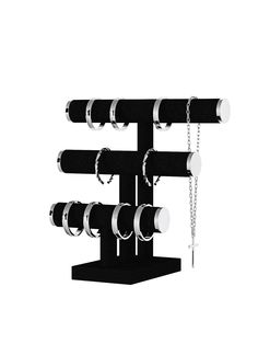 a black and white clock with chains hanging from it's sides