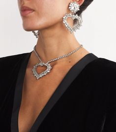 Find ALESSANDRA RICH Crystal Heart Clip-on Earrings on Editorialist. The gleeful feeling of getting ready for an evening out inspired Alessandra Rich to create her namesake label, a brand that fearlessly celebrates femininity. Large jewels and unabashed designs are a given, which is exactly what the Crystal Heart earrings bring to the table, acting as a final touch to complete any eveningwear ensemble. Heart Clip, Crystal Heart Earrings, Alessandra Rich, Fine Watches, Final Touch, Shoes Heels Pumps, Boots Knee, Men's Beauty, Trending Gifts