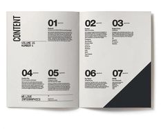 an open magazine with black and white numbers on the front cover, inside pages spread out