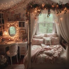 a bedroom decorated in pink and white with flowers on the bed, lights strung over the window