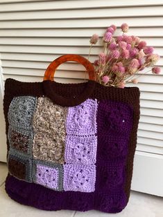 "Purple? Blue? Your choice...either side, you'll be the coolest looking on the block when holding this bag. Super cool as a grocery bag, a bag for your files and folders, or just to show it off...your choice because you'll definitely get some awww. Great gift too! Surprise someone special who loves granny squares with this lovely bag or keep it for yourself. Approx measurement: 17\" (without handles) x 15\" x 3\" #Handmade; lined #Item colors may vary slightly because of lighting. #I am not responsible for all the awww and smile...and the compliments you get :)" Vintage Rectangular Crochet Bag For Everyday, Vintage Square Crochet Bag For Daily Use, Retro Crochet Granny Square Bag For Daily Use, Brown Crochet Bag With Granny Square Design, Retro Granny Square Crochet Bag For Daily Use, Brown Granny Square Crochet Tote Bag, Brown Crochet Tote Bag With Granny Square, Everyday Brown Crochet Bag With Granny Square, Blue Granny Square Rectangular Shoulder Bag