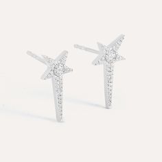 SKU# E-10806 Diamond Weight 0.11cts Earring Length 16.68 mm Width 8.57 mm Thickness 2.10 mm Post back closure Finish 14k gold plated sterling silver or in sterling silver. Avoid contact with anything containing derivatives of alcohol. Elegant Silver Star-shaped Diamond Earrings, Celestial Earrings With Diamond Accents For Anniversary, Sterling Silver Star-shaped Diamond Earrings, Elegant Star-shaped Sterling Silver Diamond Earrings, Elegant Star-shaped White Gold Diamond Earrings, Elegant White Gold Star-shaped Diamond Earrings, Sterling Silver Star-shaped Jewelry With Prong Setting, Sterling Silver Star Jewelry With Prong Setting, Star-shaped White Gold Diamond Earrings