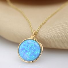 A beautiful large Opal necklace is the perfect statement piece. Set with a genuine 10 mm blue Opal gemstone Most recommended as a set with our beautiful Blue Opal ring :) Link: https://www.etsy.com/il-en/listing/879805308/blue-opal-knot-ring-handmade-ring-opal?ref=shop_home_active_5&pro=1&frs=1 ☆ WHY THIS PIECE OF J E W E L R Y IS AWESOME! ☆ * Hand finished and made from high quality raw materials * Available in Gold filled, Red gold Filled or Sterling Silver * Long lasting beauty & Elegant Blue Necklace For Birthday Gift, Opal Birthstone Necklaces, Opal Birthstone Round Necklaces, Round Opal Birthstone Necklaces, Elegant Blue Jewelry For Birthday Gift, Elegant Opal Necklace With Wire Wrapped Detail, Blue Birthstone Necklace As Gift For Her, Gold Opal Round Necklaces, Gold Opal Round Necklace