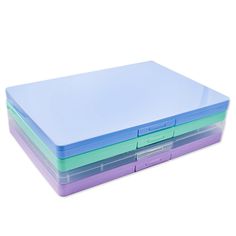 three different colored plastic trays stacked on top of each other