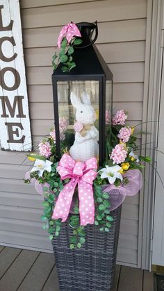 a basket with flowers and a bunny in it