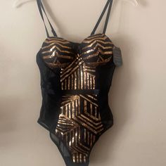 Beautiful Black Gold Sequin And Black Sheer Bodysuit With Soft Padded Bra Black And Gold Bodysuit, Gold Bodysuit For Night Out, Chic Gold Party Bodysuit, Fitted Party Bodysuit With Lined Body, Fitted Bodysuit With Lined Body For Party, Chic Party Bodysuit With Lined Body, Gold Sleeveless Bodysuit For Night Out, Gold Party Bodysuit With Lined Body, Lined One-piece Bodysuit For Party