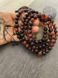 This Brown Agate Mala necklace has a brownish tone that will be easy to match your everyday outfits and keep you calm and grounded if you use it while meditating. Its a unique decor item also. A perfect gift for a yoga lover, or someone that loves stones. You can use it as a necklace or wrap it around the wrist and becomes a bracelet. The Mala necklace has a drop length of 42cm- 16.5 inch. A most have addition to your jewelry collection. ⚡️Join Akashi's VIP list for early bird discount access⚡️ Amber Bead Necklace 8mm As Gift, Brown Beaded Necklaces With 8mm Beads As A Gift, Brown Beaded Necklaces With 8mm Beads For Gifts, Brown Beaded Necklaces As Gifts, Amber Necklaces With 8mm Beads For Gift, Amber Necklace With 8mm Beads For Gift, Spiritual Brown Polished Beaded Necklaces, Brown Round Beaded Necklaces For Spiritual Purposes, Brown Beaded Necklaces With 8mm Round Beads