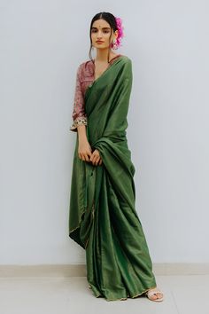 Emerald green saree with contrast woven stripes and zardozi embroidered border. Paired with printed magenta unstitched blouse fabric.
Component: 2
Fabric: Handloom Munga Silk
Color: Green
Blouse fabric: 1 metre
Note: Blouse worn by the model is not for sale - Aza Fashions Striped Saree, Saree Green, Saree Blouses Online, Saree For Women, Silk Saree Blouse, Green Saree, Blouse For Women, Designer Gowns, Green Blouse