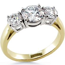 three stone diamond ring in yellow gold with diamonds on the sides and four stones at the top