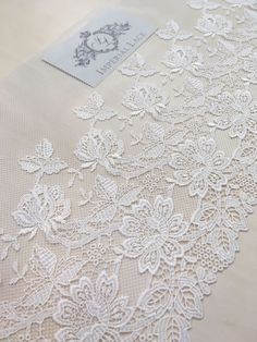 the white lace is laying on top of the table