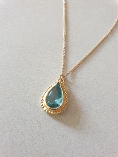 This 14k gold filled Blue Topaz necklace was designed in an antique style, with a bright Turquoise colored pendant in a teardrop shape. The gemstone birthstone necklace is handmade and delicate and available both in 14 karat gold filled and sterling silver. The Blue Topaz is lab made. Dimensions: Pendant height is 0.5 inches and it is 0.3 inches wide. This pendant necklace is available in multiple lengths. Please choose on checkout. The Blue necklace is a great birthstone necklace for mom and th Gold Drop Necklace With Birthstone Teardrop Pendant, Gold Teardrop Pendant Necklace With Birthstone, Gold Drop Necklace With Birthstone, Gold Birthstone Drop Necklace, Yellow Gold Teardrop Birthstone Necklace, Elegant Turquoise Teardrop Pendant Drop Necklace, Gold Drop Birthstone Necklace With Gemstone, 14k Gold Teardrop Birthstone Necklace, Gold Pear-shaped Drop Necklace With Gemstone