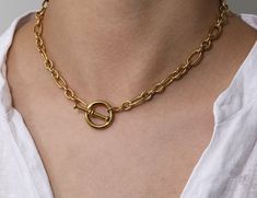 Who doesn’t love versatile? Wear this piece with the clasp in the front or back depending on your style! This stylish necklace is perfect for a simple look to wear alone or stacked with a few of our other HOJM necklaces. The quality and simplicity of it make for a necklace you never want to take off. Material: Gold Plated over Stainless Steel Base. Tarnish Free and Water Resistant Length: 16inch Allergies: Hypoallergenic Chic Toggle Necklace With Paperclip Chain For Everyday, Chic Everyday Toggle Necklace With Paperclip Chain, Trendy Necklaces With Lobster Clasp For Everyday Use, Minimalist Charm Necklaces With Lobster Clasp For Everyday, Minimalist Choker Chain Necklace With Lobster Clasp, Everyday Metal Lariat Necklaces, Minimalist Adjustable Chain Necklace With Lobster Clasp, Everyday Toggle Necklace With Chain, Metal Chain Necklace For Everyday Use