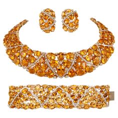 Statement citrine and diamond necklace, bracelet, and earrings set. 365.10 carats of oval citrine quartz. 770 round brilliant diamonds, 26.76 carats. Approximately G/H color grade and SI clarity grade. 18-karat yellow gold, necklace 16 inches, bracelet 6.75 inches, and earrings 1.25 inches. 391.86 carats total gemstone weight. Willing to sell necklace, bracelet, or earrings separately. Accommodated with an up-to-date appraisal by a GIA G.G. once purchased, upon request. Please contact us with an Modern Diamond Jewelry, Citrine Birthstone, Orange Jewelry, Retro Bracelet, Citrine Jewelry, Diamond Necklace Set, Moissanite Necklace, Yellow Gold Necklace, Dope Jewelry